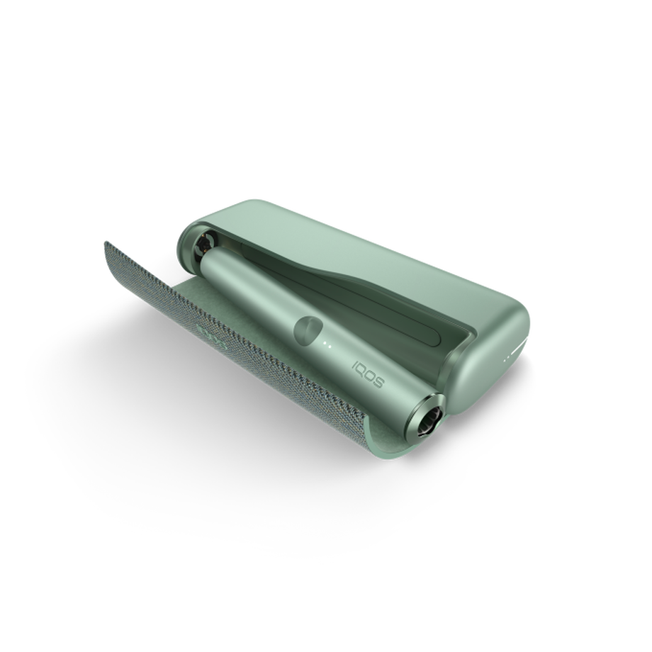 IQOS ILUMA PRIME JADE GREEN Mobility Kit, Jade Green A Jade Green IQOS ILUMA PRIME device inside a holder with the door open.