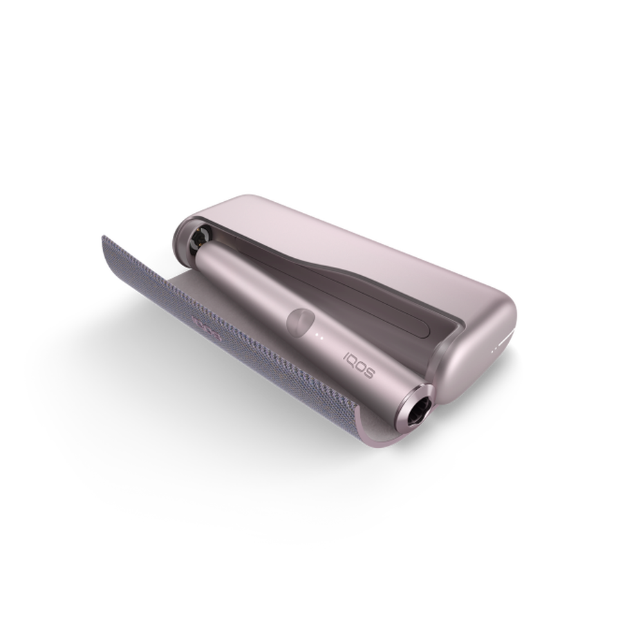 IQOS ILUMA PRIME BRONZE TAUPE Mobility Kit, Bronze Taupe A Bronze Taupe IQOS ILUMA PRIME device inside a holder with the door open.