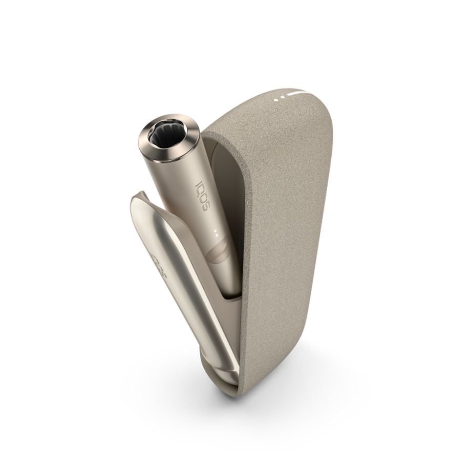 IQOS ILUMA PEBBLE BEIGE Mobility Kit, Pebble Beige A Pebble Beige IQOS ILUMA device inside a holder with the door open.