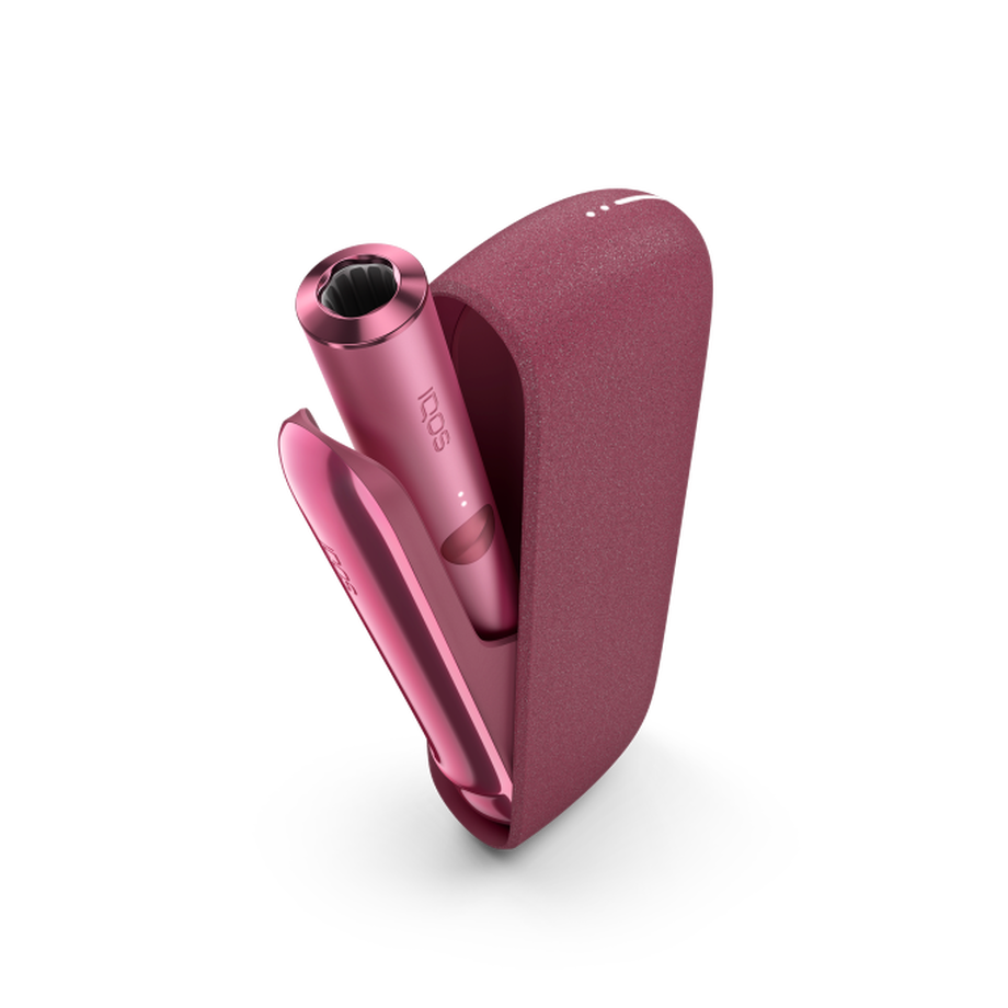 IQOS ILUMA SUNSET RED Mobility Kit, Sunset Red A Sunset Red IQOS ILUMA device inside a holder with the door open.