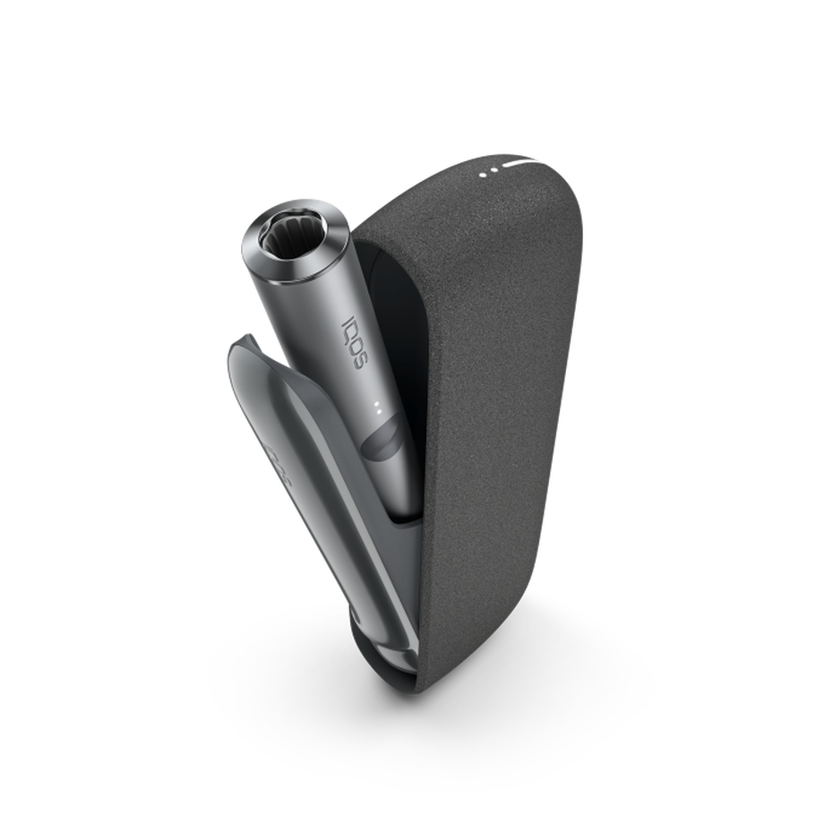 IQOS ILUMA PEBBLE GREY Mobility Kit, Pebble Grey A Pebble Grey IQOS ILUMA device inside a holder with the door open.