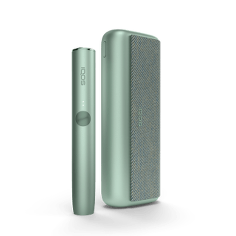 A jade green IQOS ILUMA PRIME device and holder.