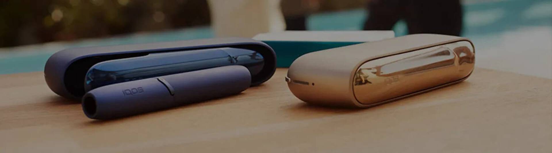 Different IQOS devices on a table