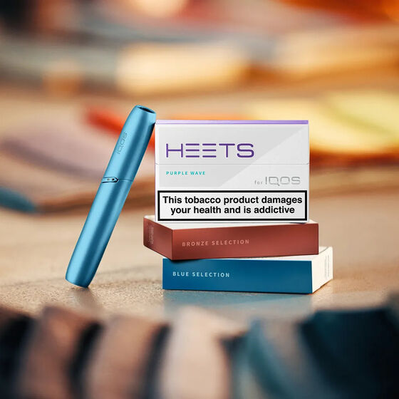 IQOS Originals Duo holder next to HEETS tobacco sticks available in different flavours