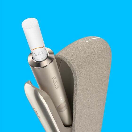 An IQOS ILUMA holder inside a charger.
